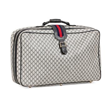 626. GUCCI, a blue monogram canvas suitcase.