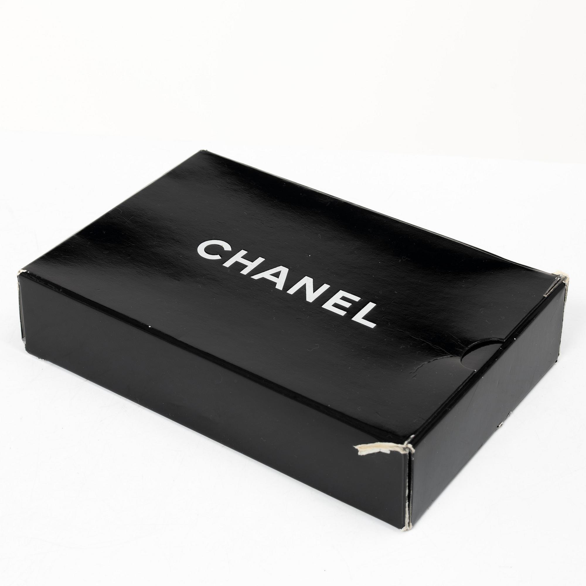 Chanel, A black leather vintage pouch, 1989-1991.