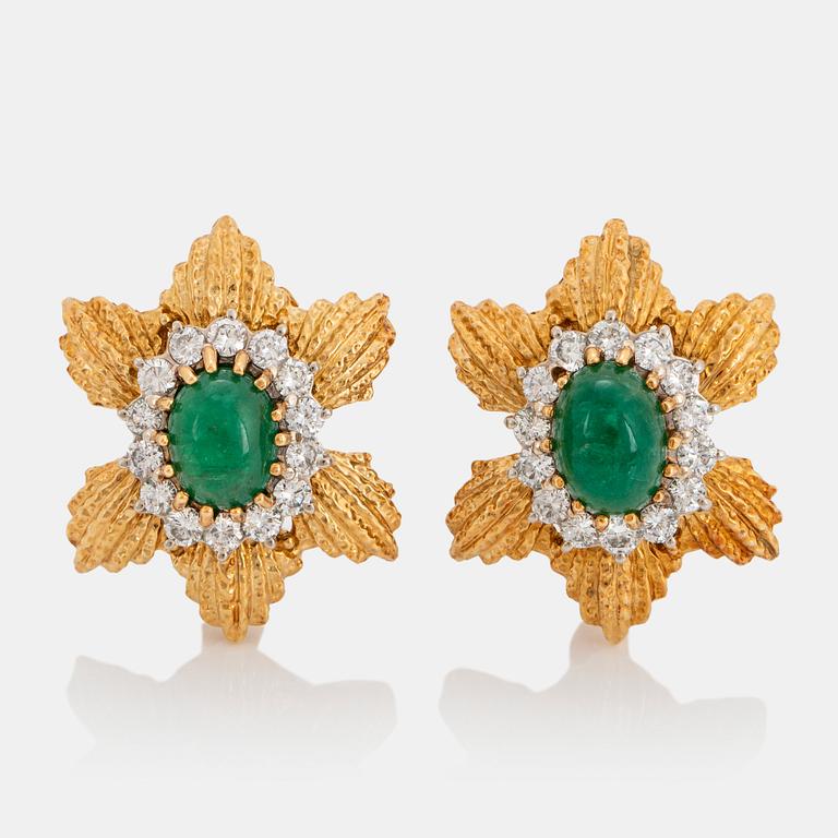 A pair of 18K gold earrings set with cabochon-cut emeralds and round brilliant-cut diamonds.