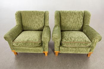 A pair of Swedish Modern lounge chairs.