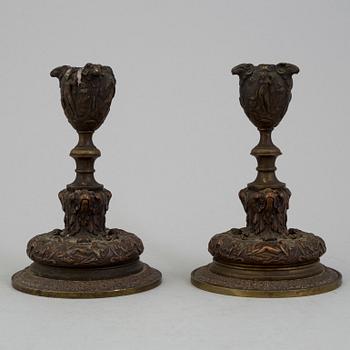 A PAIR OF BRONZE CANDLESTICKS, mid 19th century.