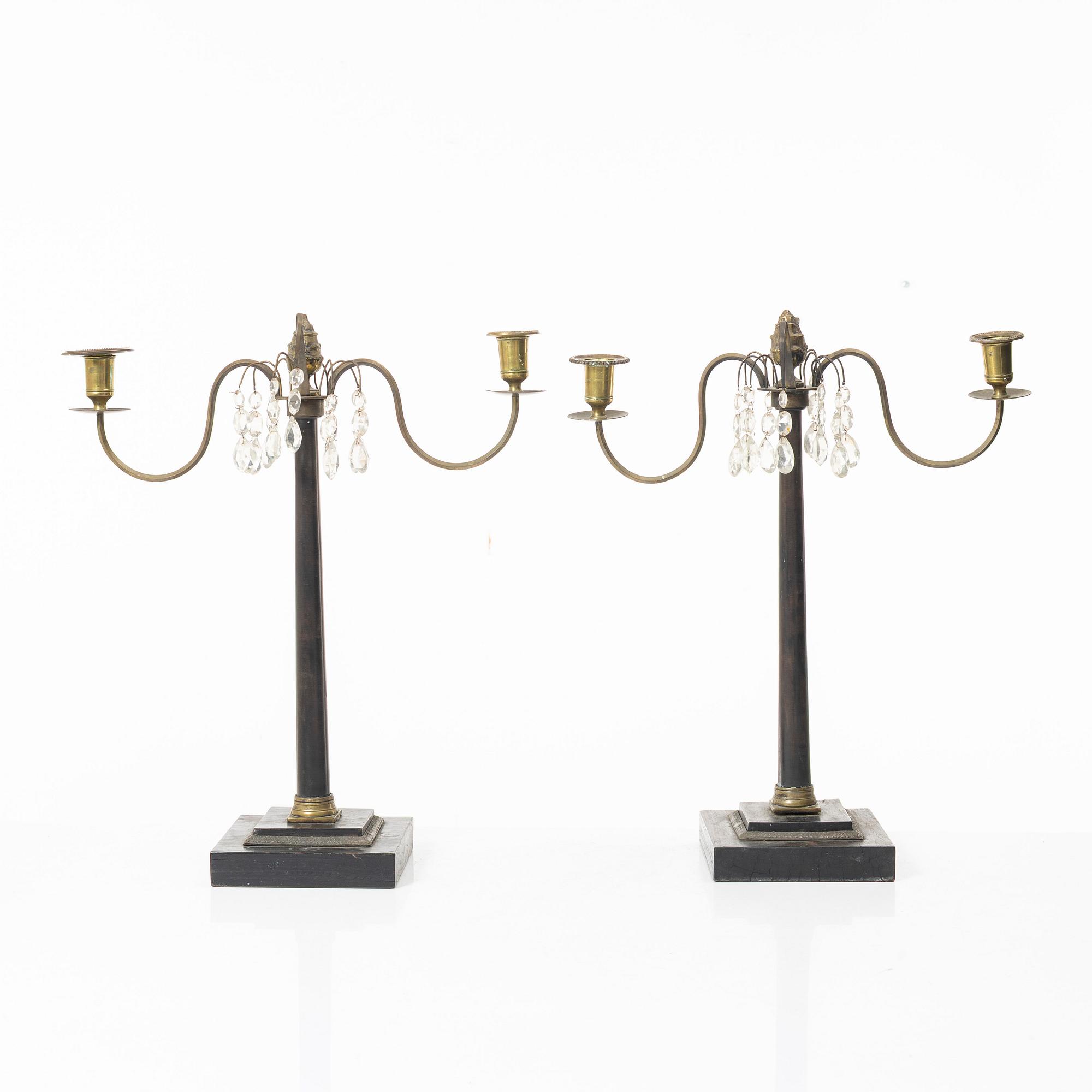 A pair of wooden candelabras, around 1900.
