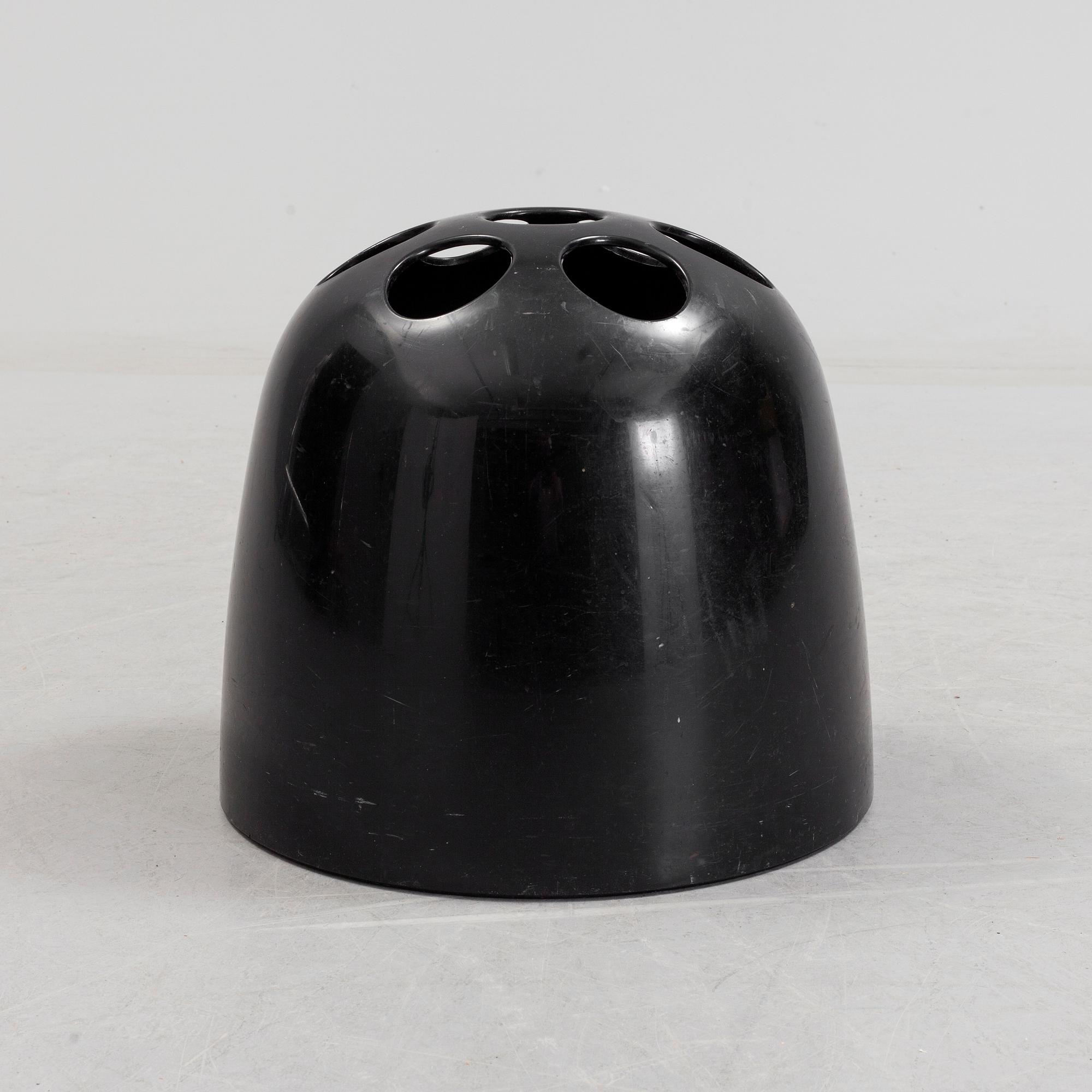 EMMA GISMONDI SCHWEINBERGER, a 'Dedalo' plastic umbrella stand from Artemide, Milan, Italy.