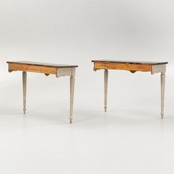 A pair of Louis XVI-style console tables, around the year 1900.