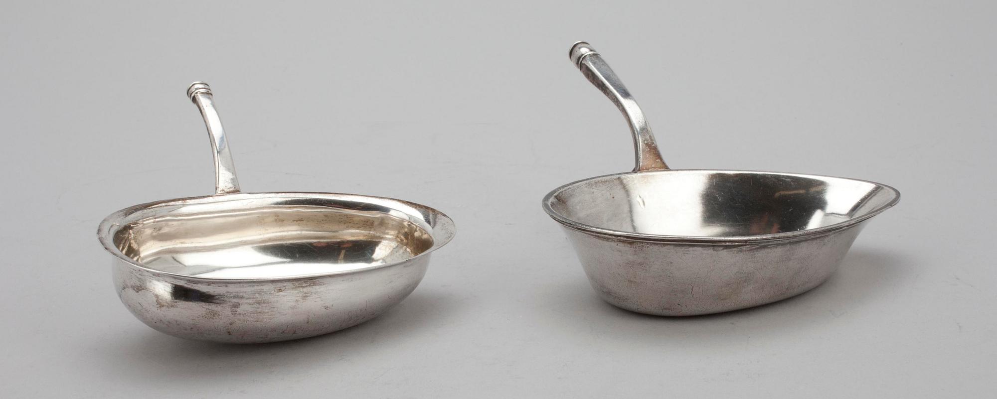 FÖRLÄGGARE, 2 st, OMGJORDA TILL GRÄDDSNÄCKOR, silver, Finland 1800-tal. Vikt 252 g.