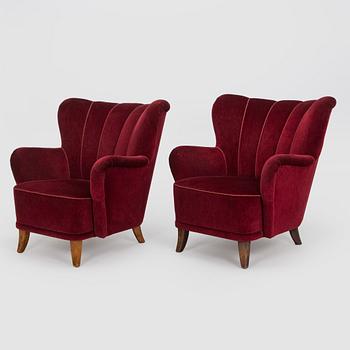 A pair of mid-20th-century armchairs.