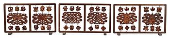 A set of three partly lacquered and gilded wooden screens, Qing dynasty (1644-1912).