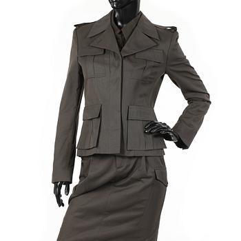 GUCCI, a three-piece suit consisting of jacket, shirt and skirt.