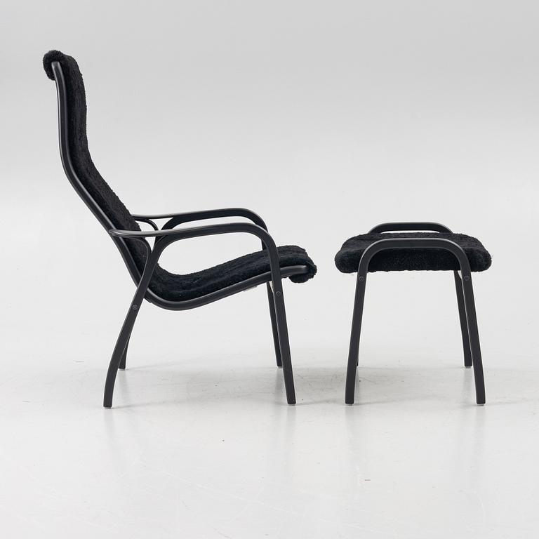 Yngve Ekström, a 'Lamino' easy chair with footstool, Swedese, 2018.