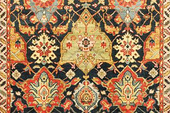 An oriental carpet with Mamluk design, a. 331 x 274 cm.
