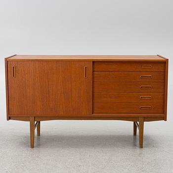 A 1950's teak veneered sideboard.