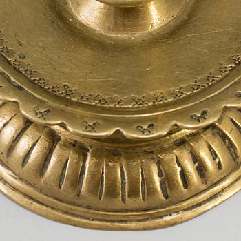 A 16th century bronze candlestick.
