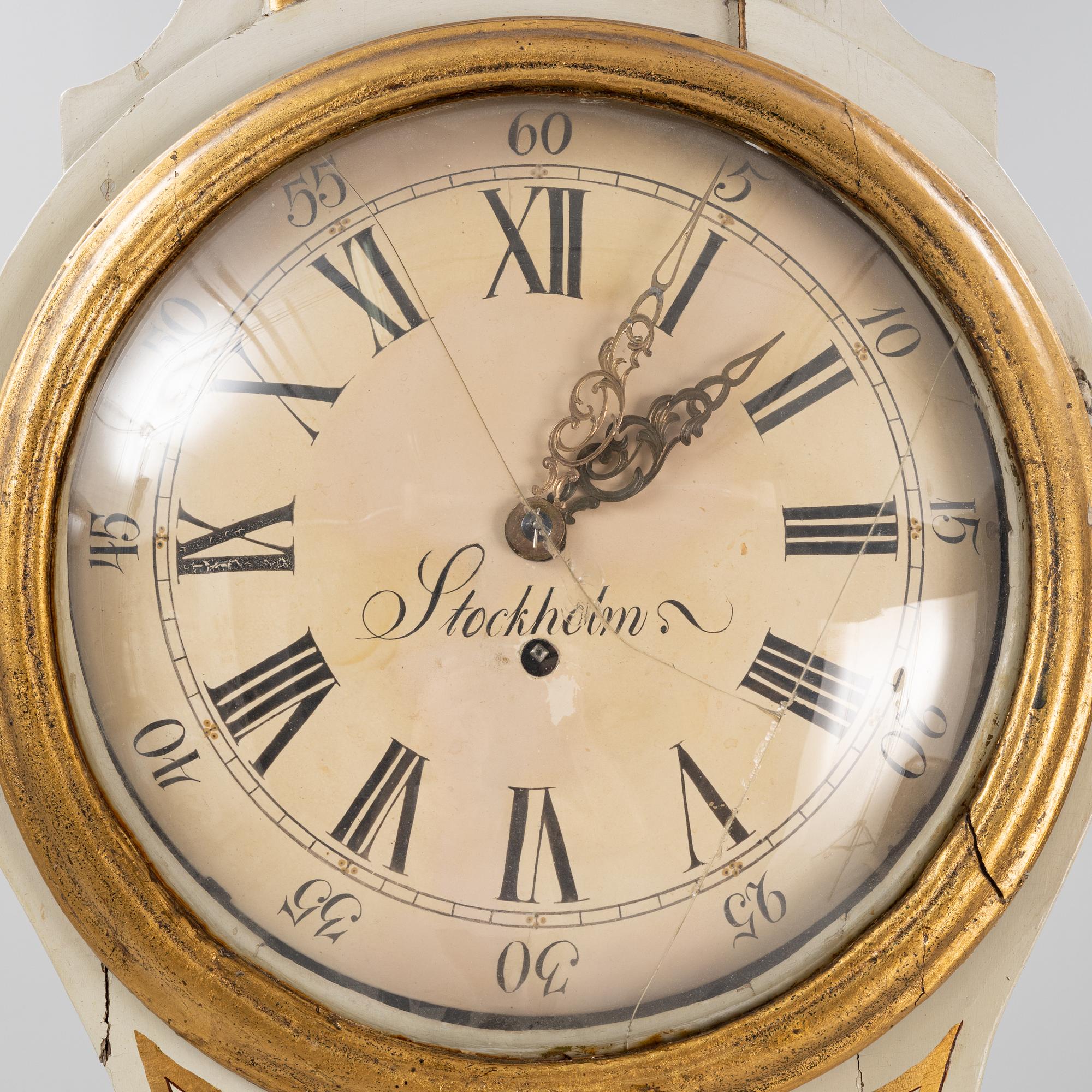 A long-case clock, 19th century.