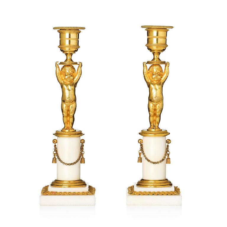 A pair of late Gustavian ormolu and white marble candlesticks, Stockholm, late 18th century.