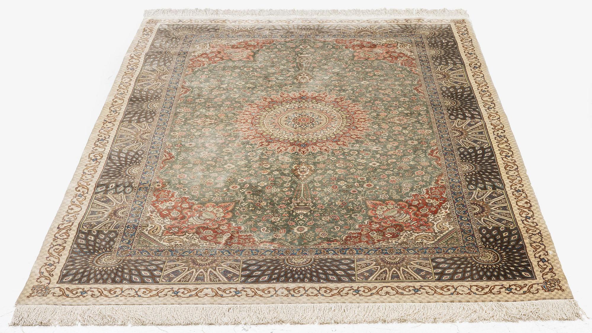 A silk Qum, Central Persia. signed Mohammad Gamshidi, c. 203 x 126 cm.