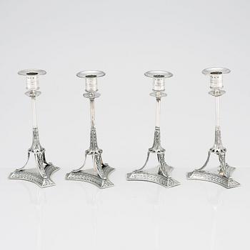 A set of four Swedish early 19th Century silver candlesticks, mark of Adolf Zethelius, Stockholm 1814 and 1818.