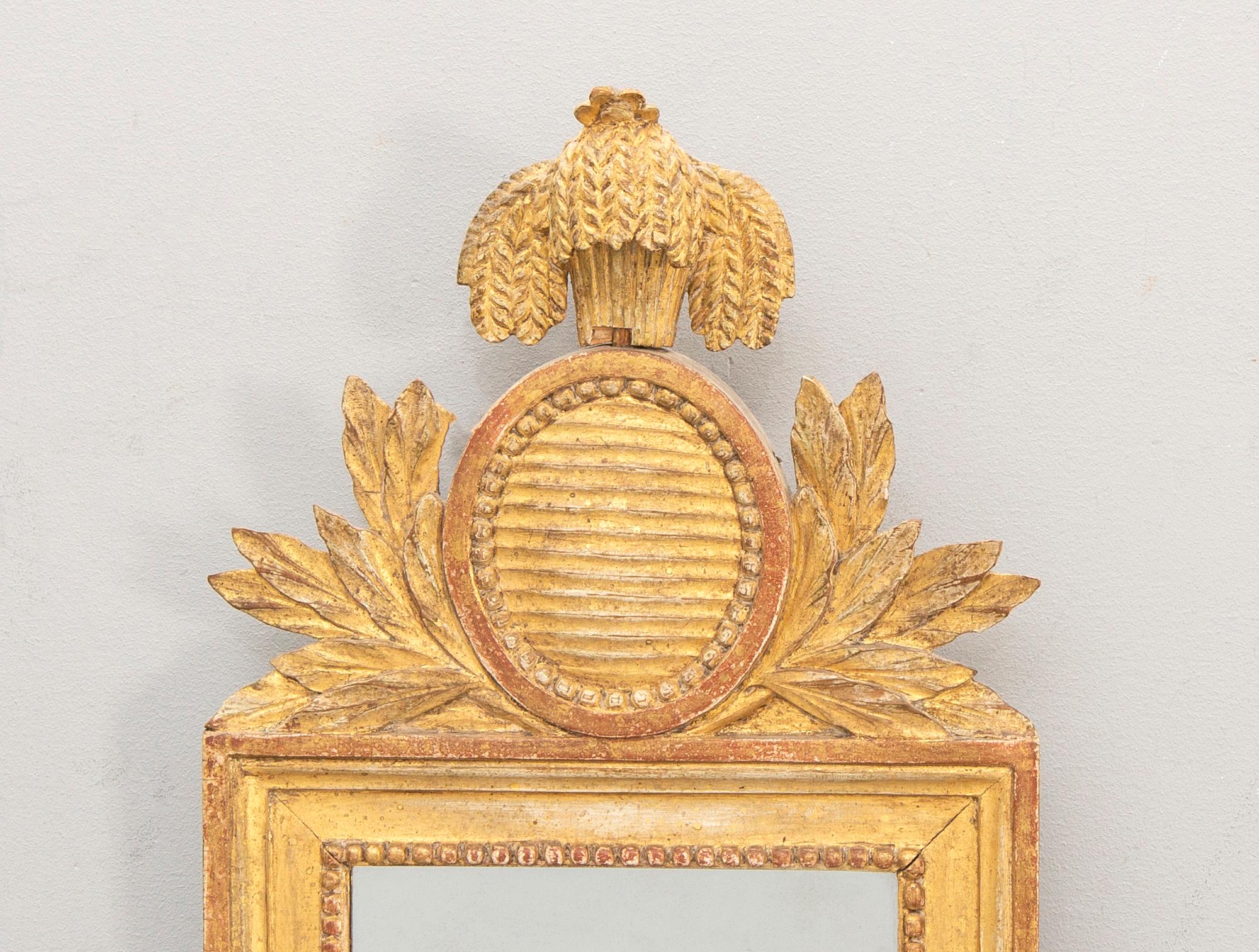 A Swedish gilded signed Gustavian mirror by CG Fyrwald.