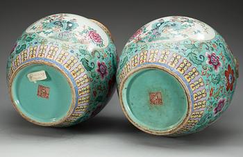 A large pair of turquoise ground famille rose vases, early 20th Century with Qianlongs sealmark.