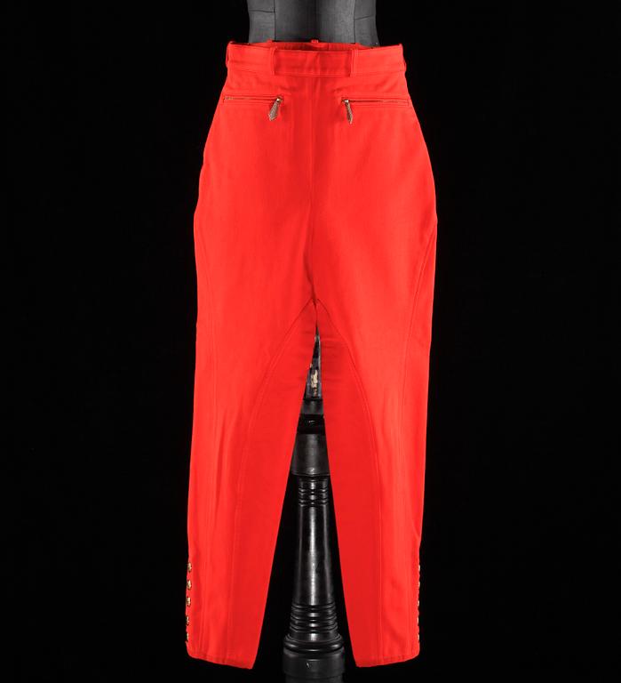 A pair of orange trousers by Hermès.