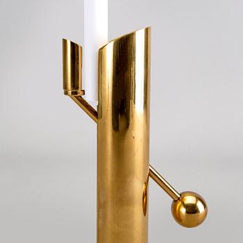 A Pierre Forssell brass candle stick for Skultuna.