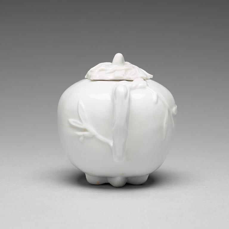 A pomegranate-shaped blanc de chine teapot with cover, Qing dynasty, Kangxi (1662-1722).