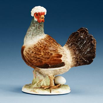 819. A Meissen figure of a hen with an egg, 19th Century.