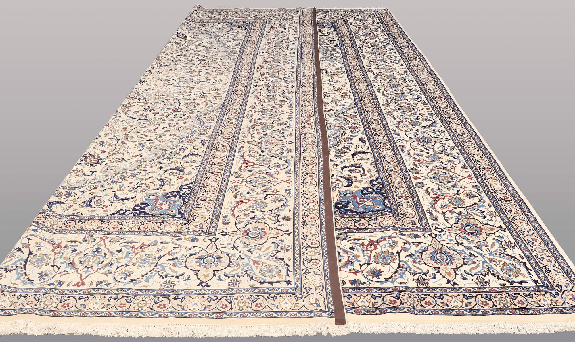 A CARPET, Nain part silk, s.k 9 LAA, 588 x 393 cm.