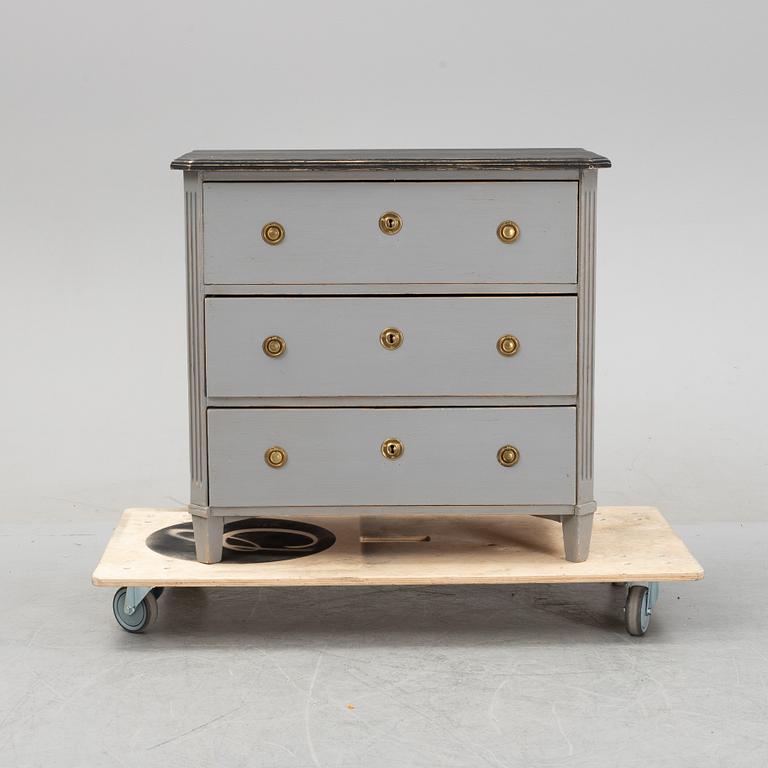 A painted gustavian style chest of drawers, early 20th century.