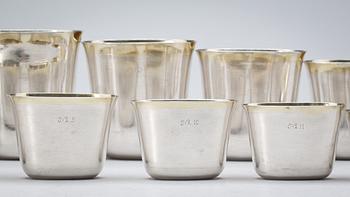 A set of 12 Swedish early 18th century parcel-gilt hunting-beakers and cover, marks of Petter Henning, Stockholm 1707.