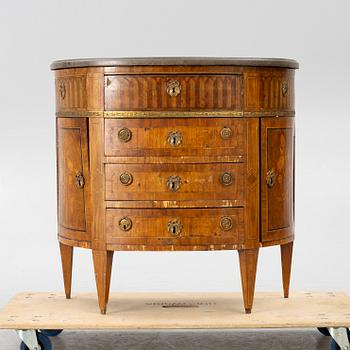 A Louis XVI style chest of drawers, 19th century.