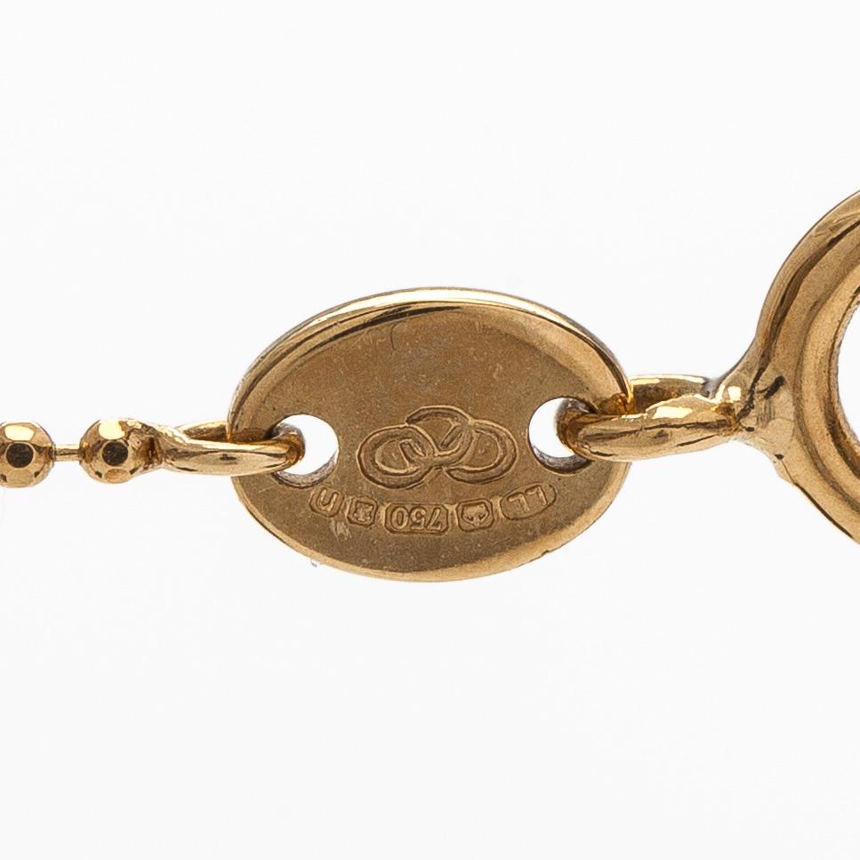 Rintaneula/riipus, kultaa siemenhelmet ja vanhahiontainen timantti, ketjulla.