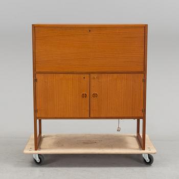 A second half of the 20th century teak veneered bar cabinet by Arne Wahl-Iversen, IKEA.