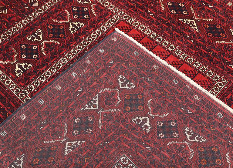 A Afghan carpet, 256 x 168 cm.