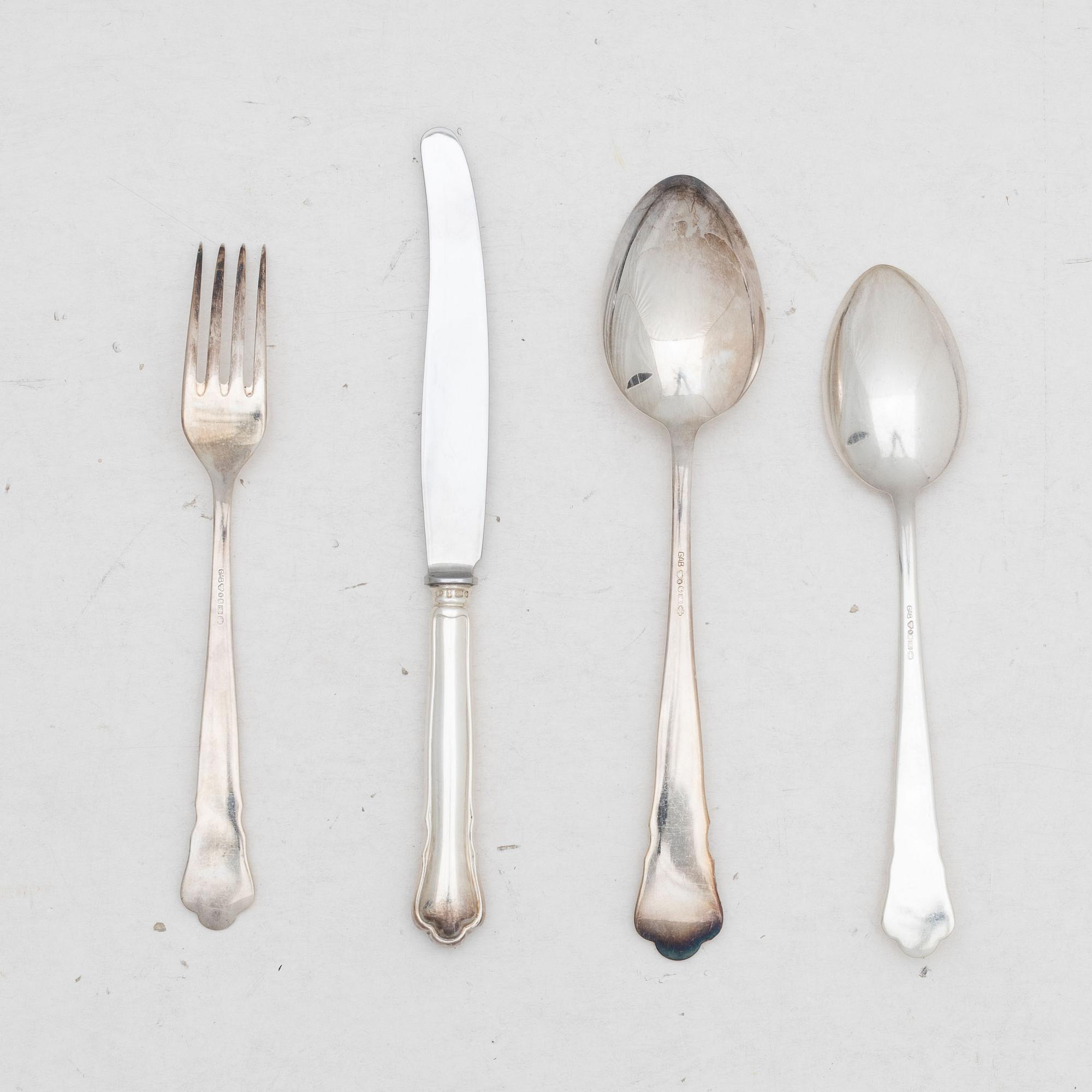 Guldsmedsaktiebolaget (GAB), A 24 piece 'Chippendale' silver cultery service, Stockholm 1950's.