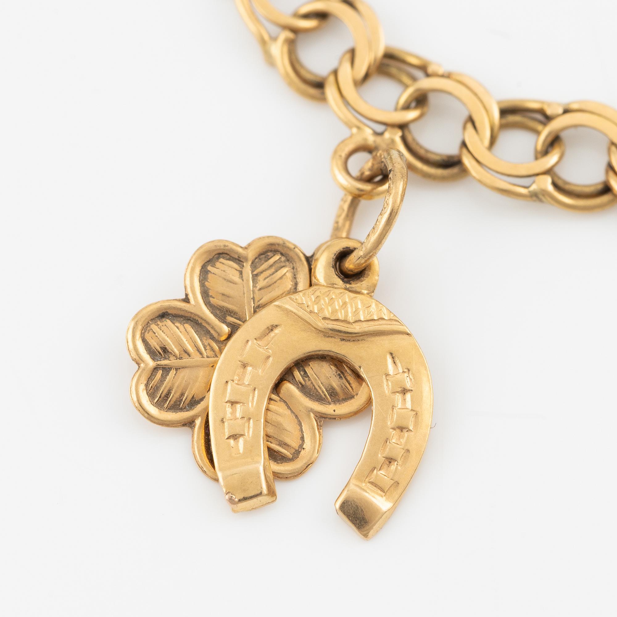 Armband, 18K guld, med berlocker.