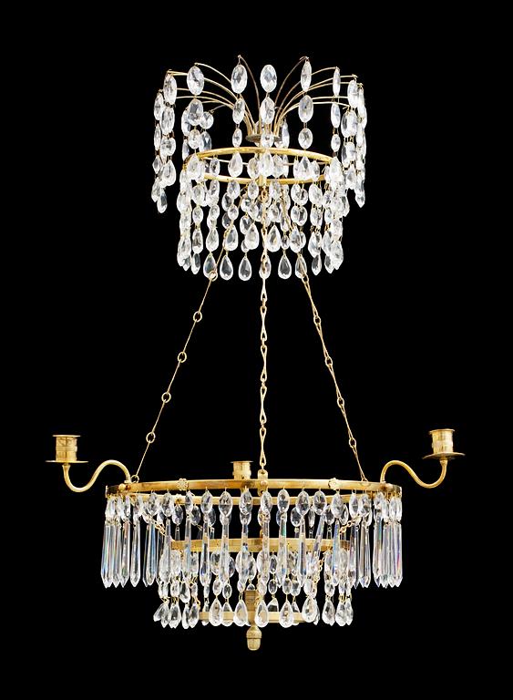 A Gustavian-style four light chandelier.