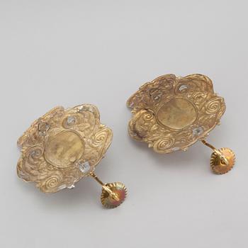 A pair of wallplates made of brass, 20th century.