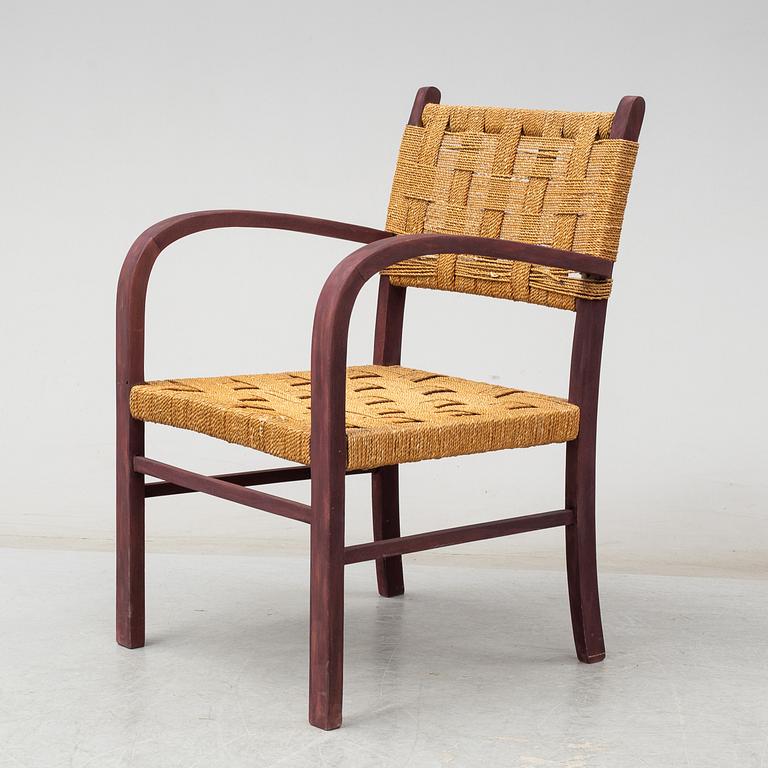 AXEL LARSSON, a stained beech armchair from Bodafors, 1930's.