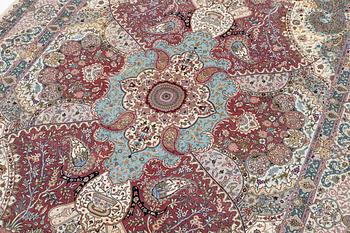 A Tabriz, carpet, 310 x 195 cm. signed.