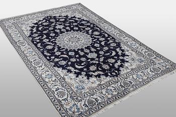 A carpet, Nain, part silk, ca 310 x 205 cm.