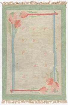 A flat weave carpet, signed PIA, c. 244 x 163 cm.