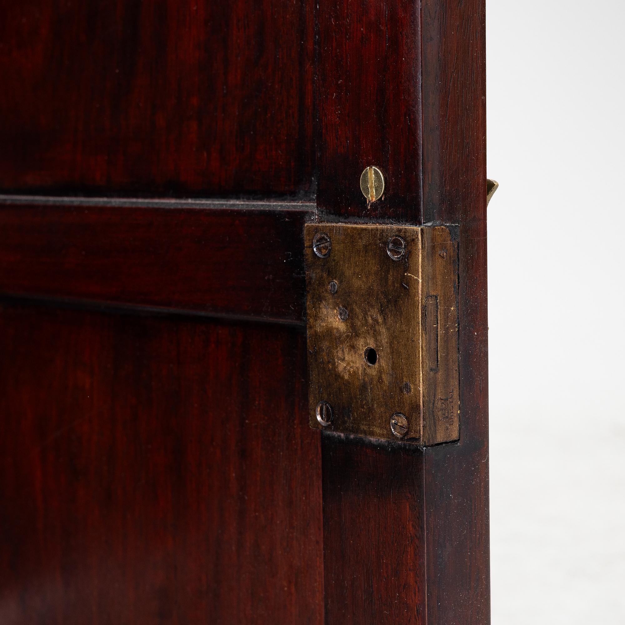 A Chinese display cabinet, wood and glass, later part of the 20th century.
