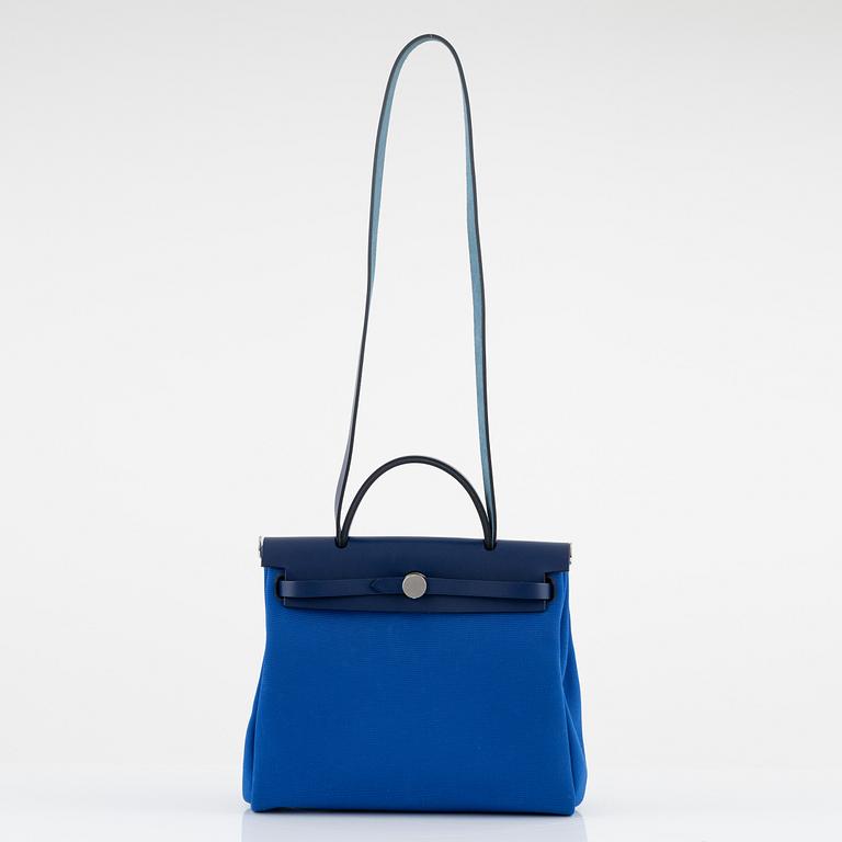Hermès, a 'Herbag Zip 31' handbag in Bleu Saphir Hunter leather and Bleu Billard military canvas, 2021.