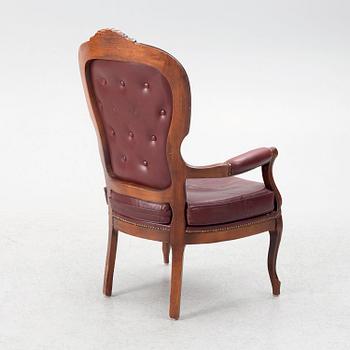 A Rococo style armchair, second half of the 20th Century.