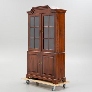 A vitrine cabinet from Åmells, dated 1974.