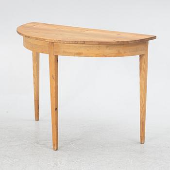 A gateleg table eith 6 + 6 chairs.