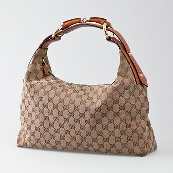 148. A Gucci shoulder case.