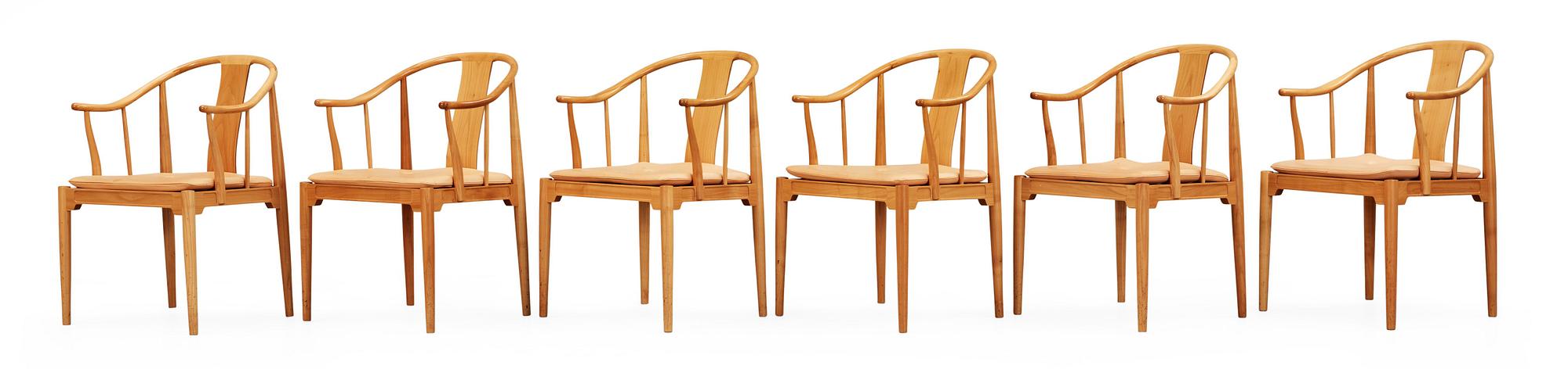 A set of six Hans J Wegner cherrywood and beige leather 'China chairs', Fritz Hansen, Denmark 1988 and 1994.