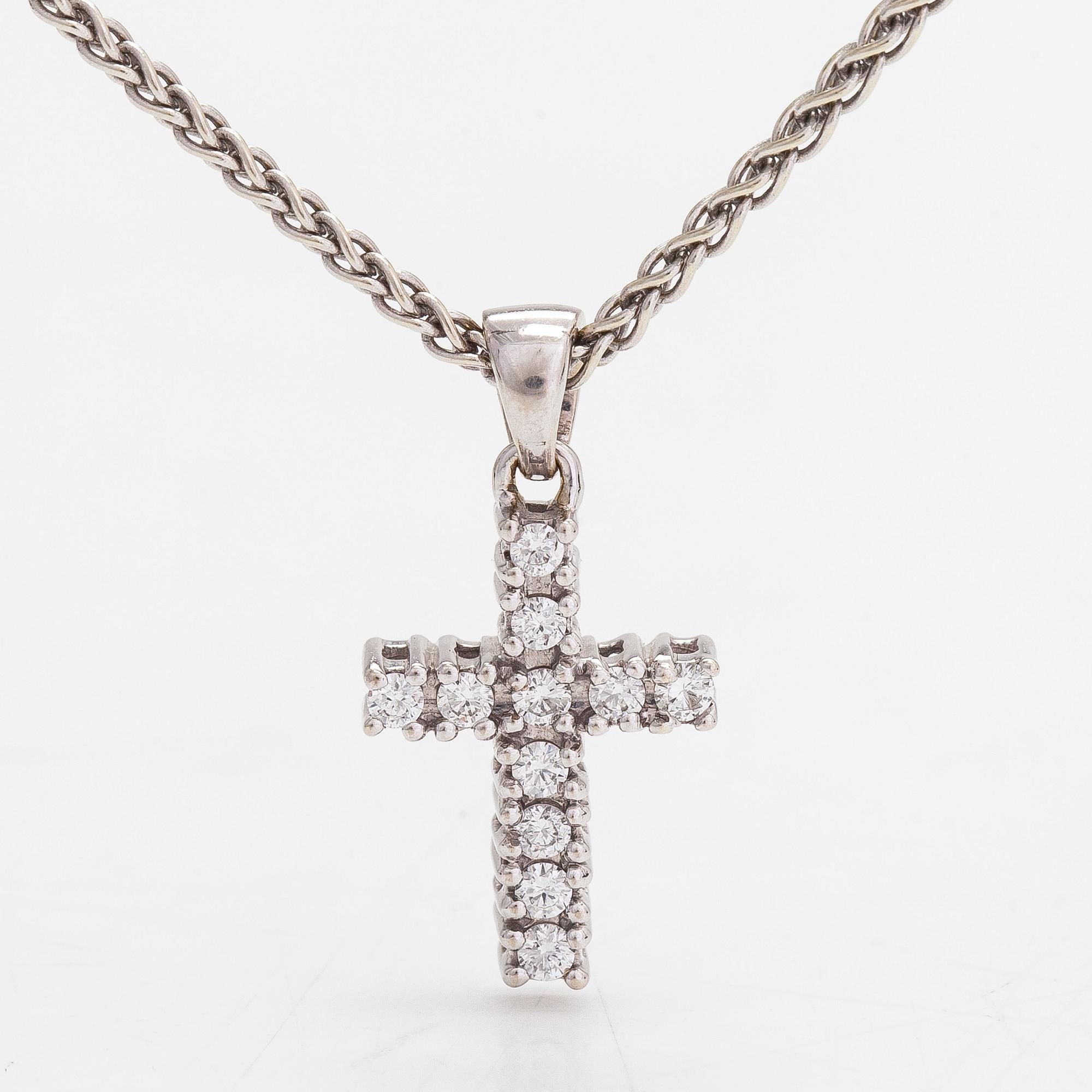 Necklace/pendant, cross, 14K white gold with diamonds totalling approx. 0.25 ct. Finnish hallmarks.