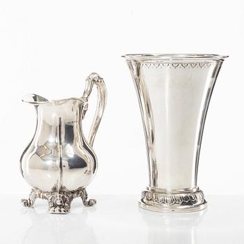 A Swedish silver beaker and a jug, including CG Hallberg, Stockholm 1927.